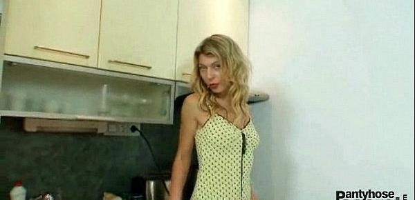  Blonde Vanesa masturbates through her blue nylons in kitchen